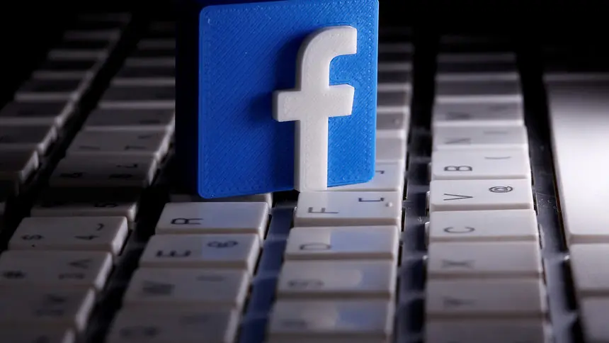 The Facebook 3D logo on top of a keyboard