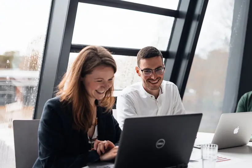 Woman and man at work doing content marketing for their business