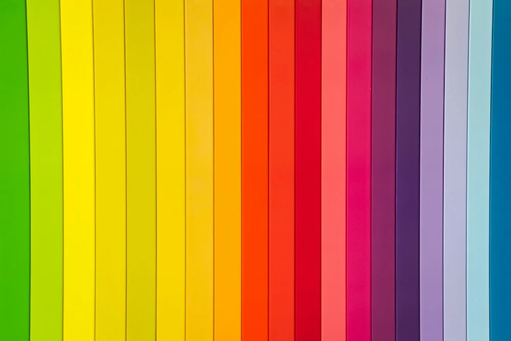 Rainbow colours+ shown in 20 thin downward lines