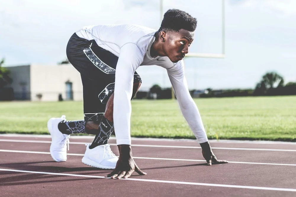 Man ready and set to start a race