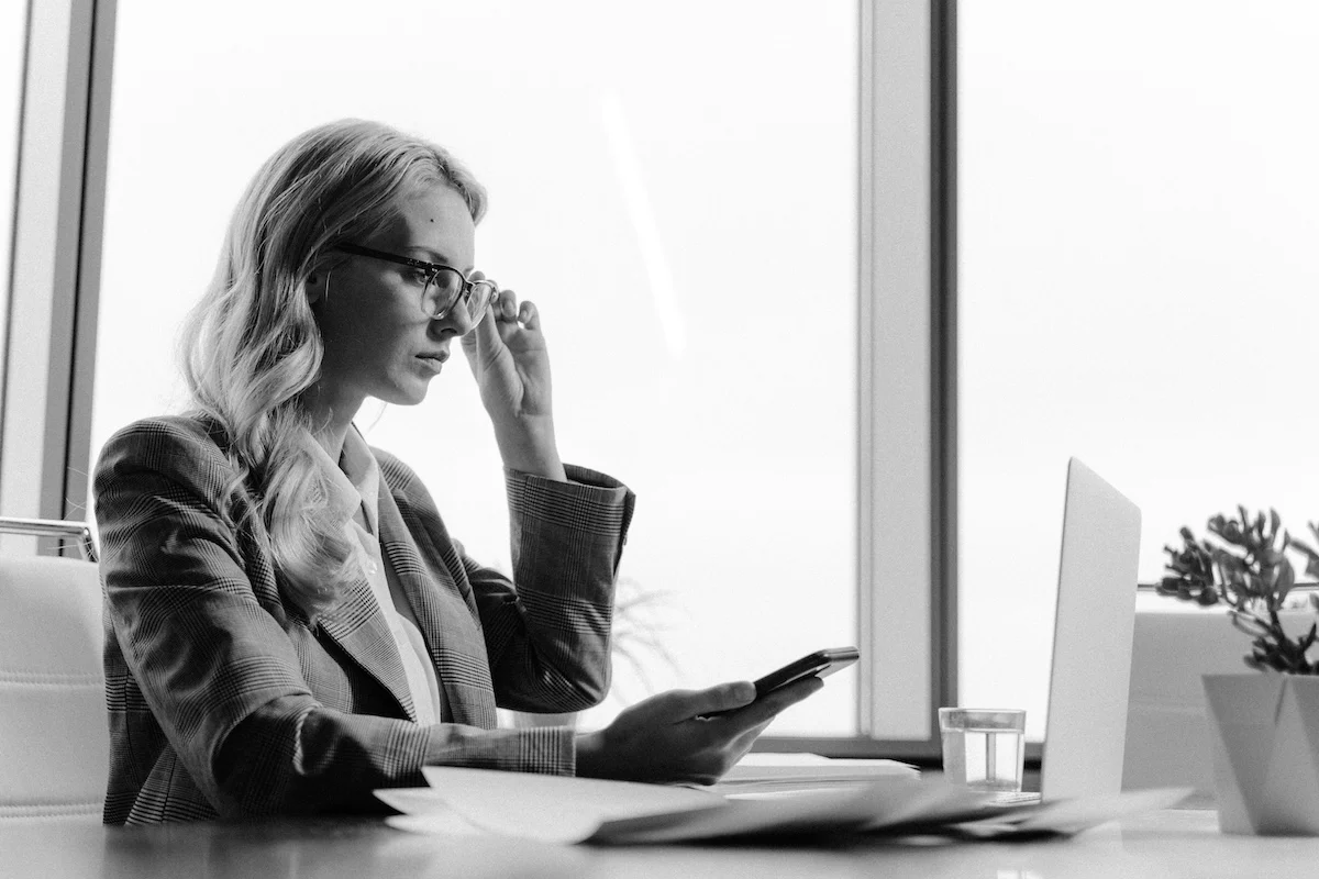 A woman looking at laptop inquisitively