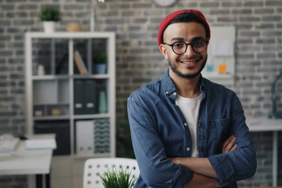 Successful business owner smiling in his office