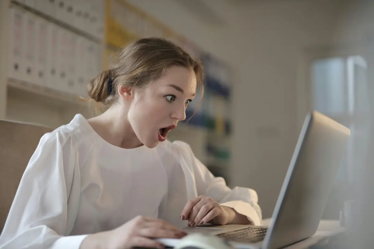 Woman looking shocked by the lack of GEO on a website