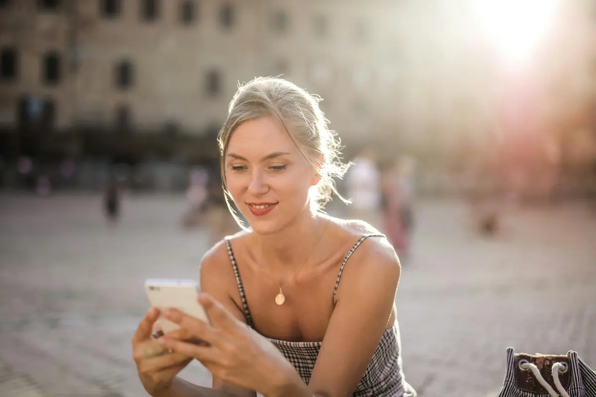 Woman happy on her smartphone by Andrea Piacquadio on Pexels. com