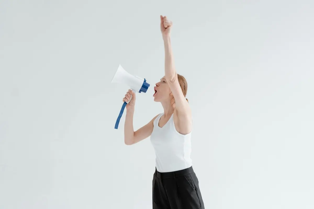 Woman shouting into a megaphone