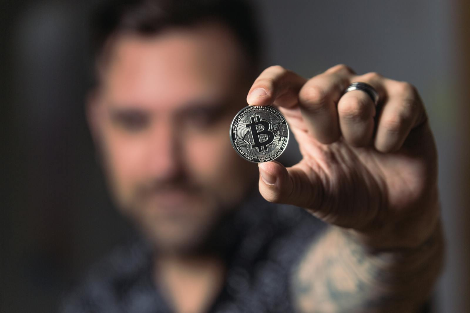 Person Holding Silver Bitcoin Coin by crypto crew on pexel.com