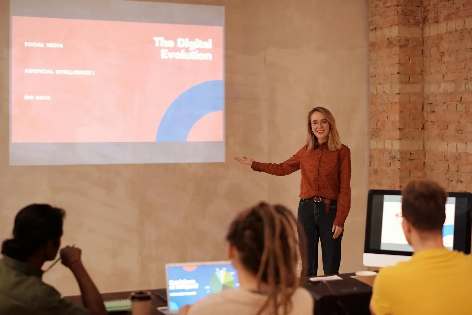 A Woman in Red Long Sleeve Shirt explaining AI Agents by Mikael Blomkvist on pexel.com