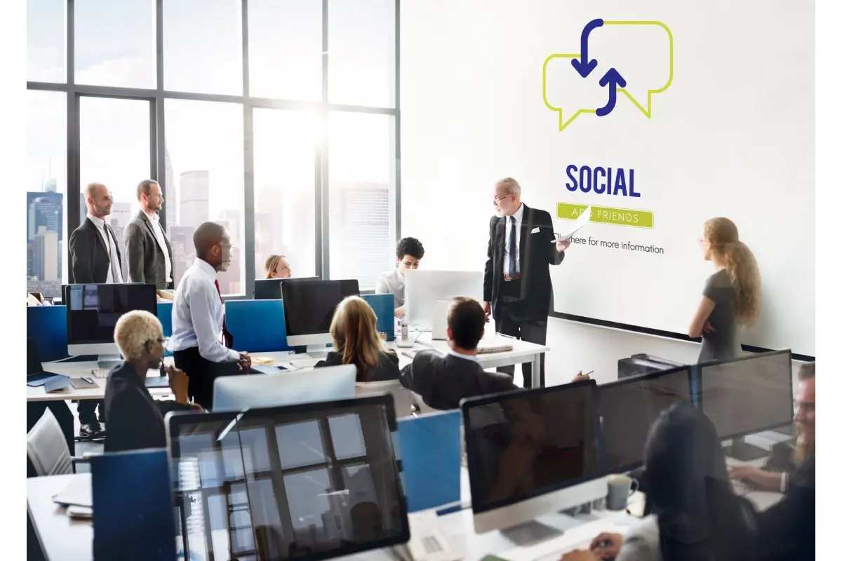 A man standing in front of his collegue to explain what socialFi