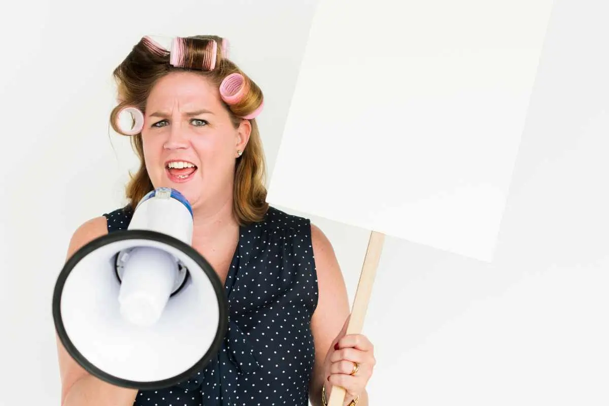 A woman speaking into a megaphone "how to spot blindspot in marketing"