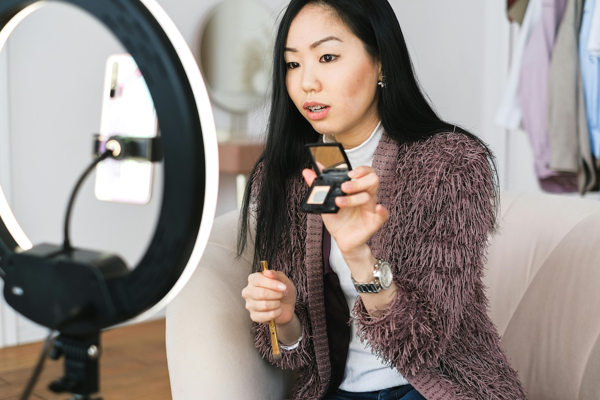 A chic east asian woman filming short-form video content by Anna Shvets on pexels. com