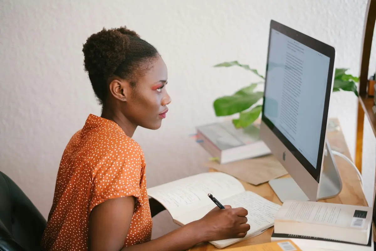 A woman at her computer leaning about AI by RF._.studio _ on Pexels. com