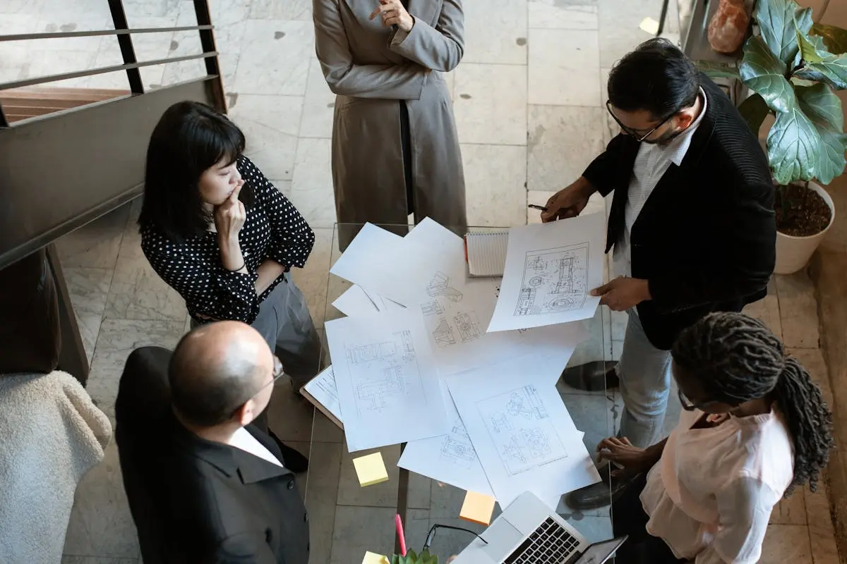 People Sitting on Chair in Front of Table discussing how to target web3 project by RDNE Stock project on pexel.com