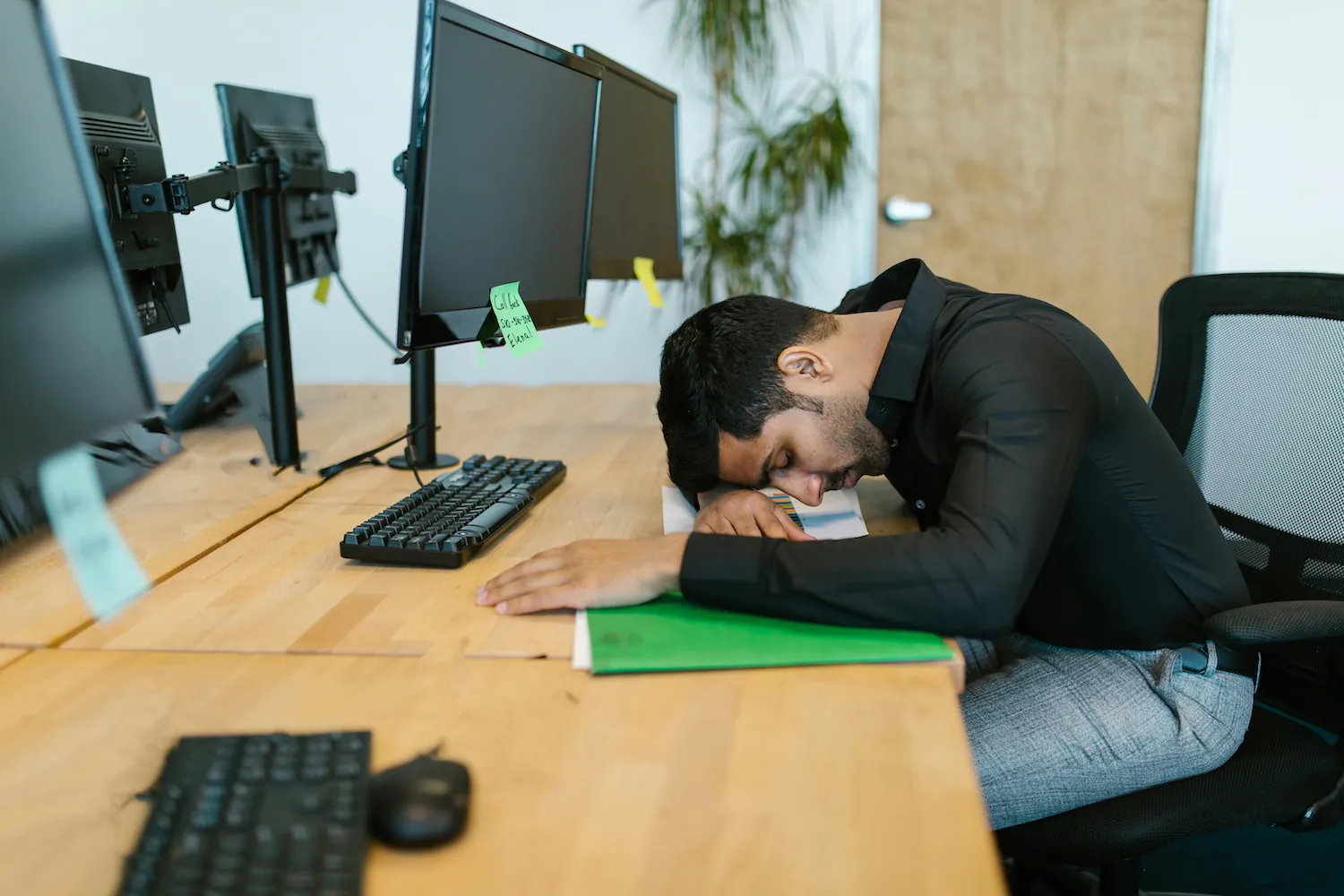 Poor staff asleep at the desk by RDNE Stock project on Pexels