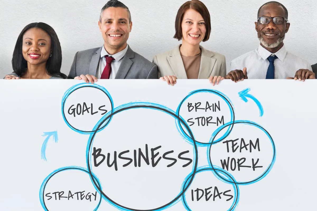 An image showing members of web3 community startup happy while holding a board