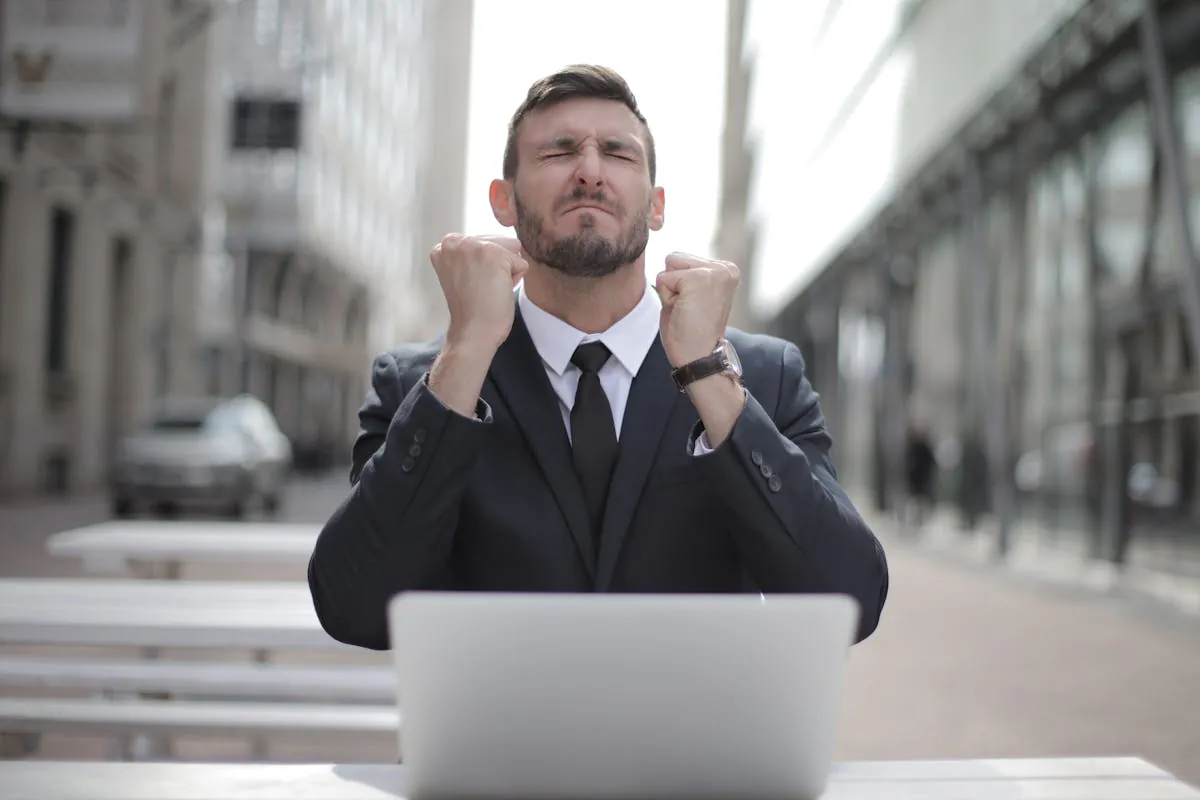 Man in Black Suit Sitting on Chair Beside Buildings using wikipedia by Andrea Piacquadio on pexel.com