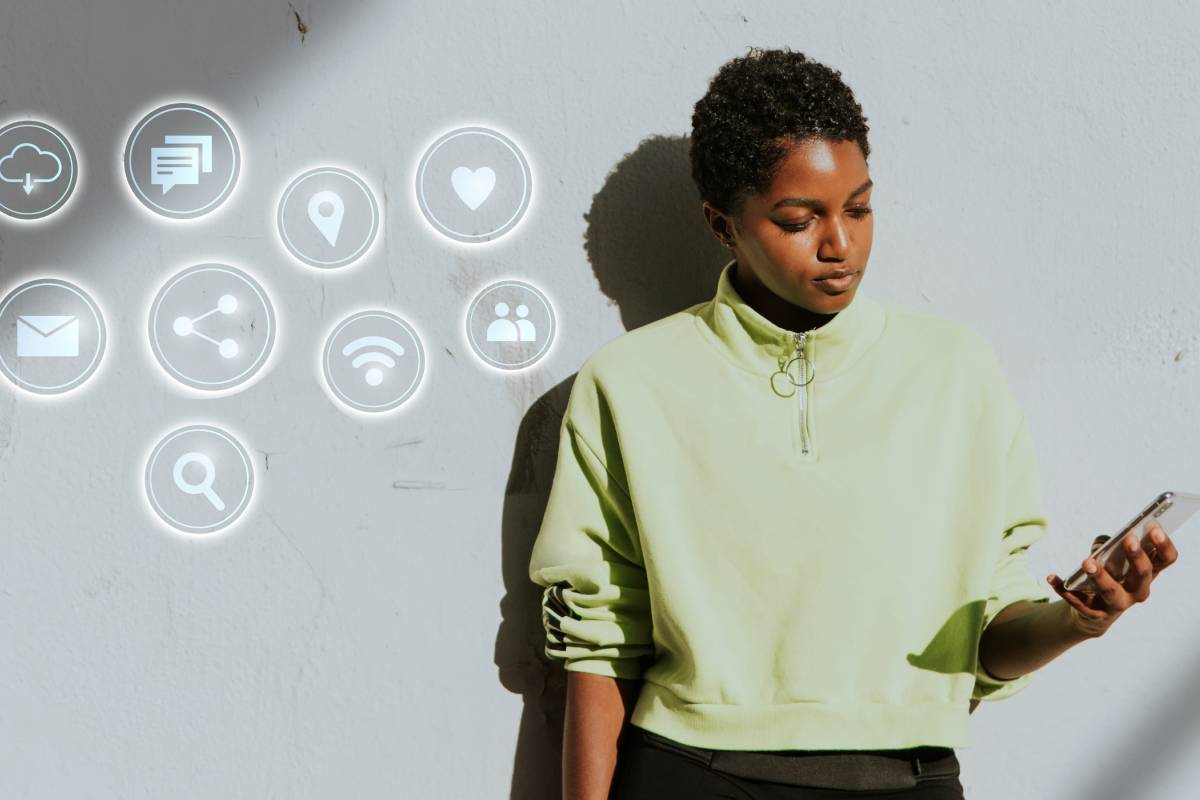 An image of a lady holding a phone