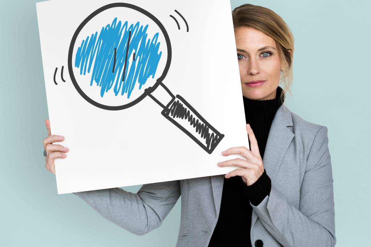 A women holding an image of a keyword search
