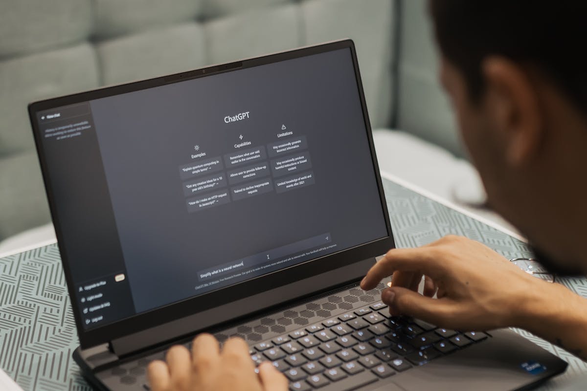 Man Using Laptop wit ChatGPT by Matheus Bertelli