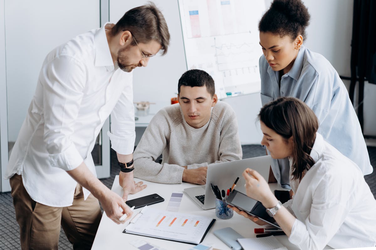 Employees Brainstorming SEO in the Office by Mikhail Nilov