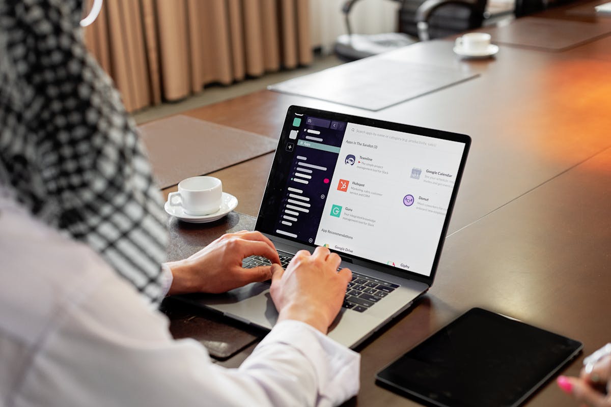 An image showing a man checking email using his laptop by Mikhail Nilov