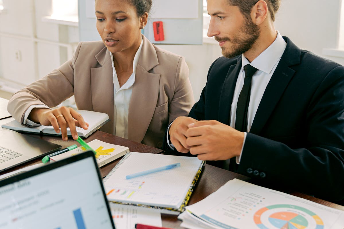 A Man and Woman Working in the Office by Antoni Shkraba Studio