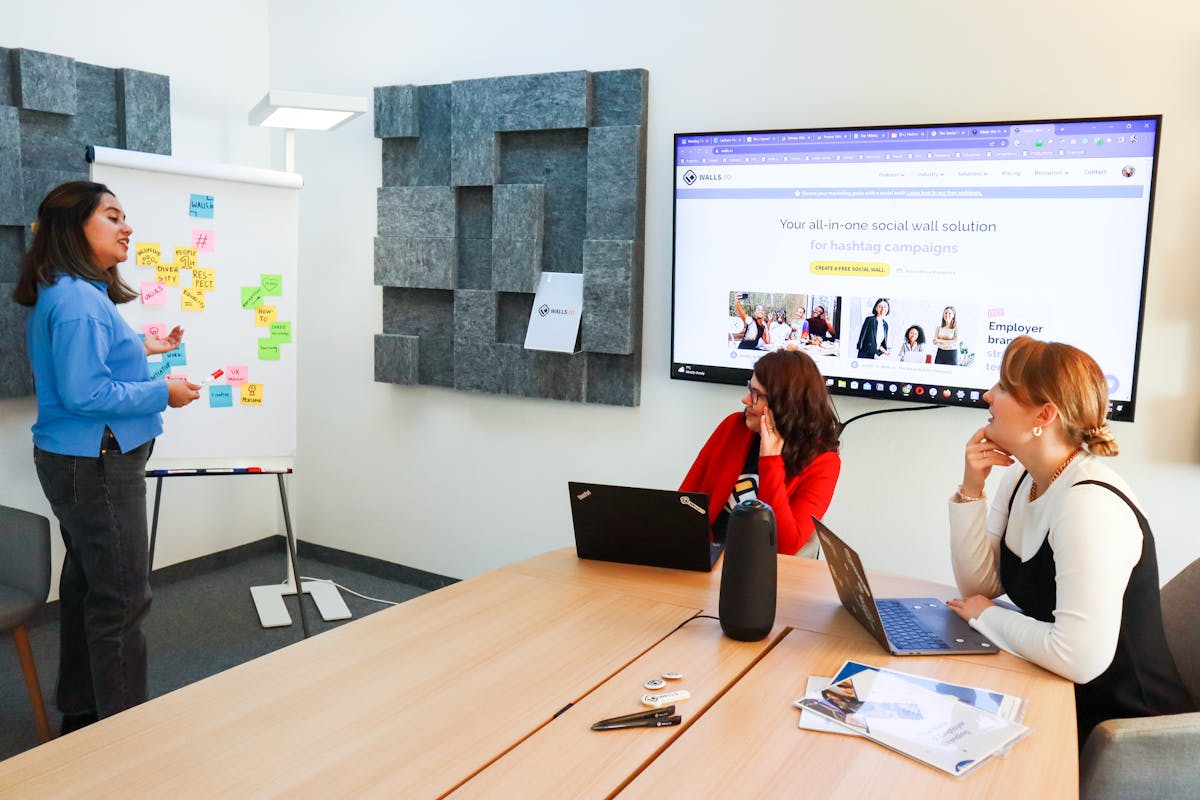 An image of web3 team discussing Social-First Ranking by Walls.io