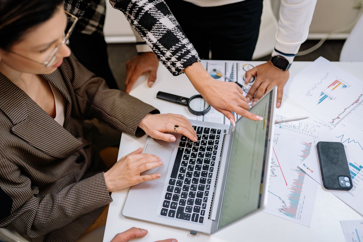 Woman and Colleagues Working on keyword search by Yan Krukau