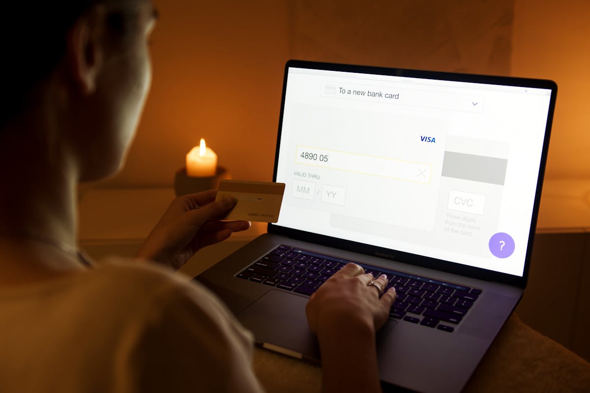 A woman makes a secure blockchain payment using a laptop by Artem Podrez