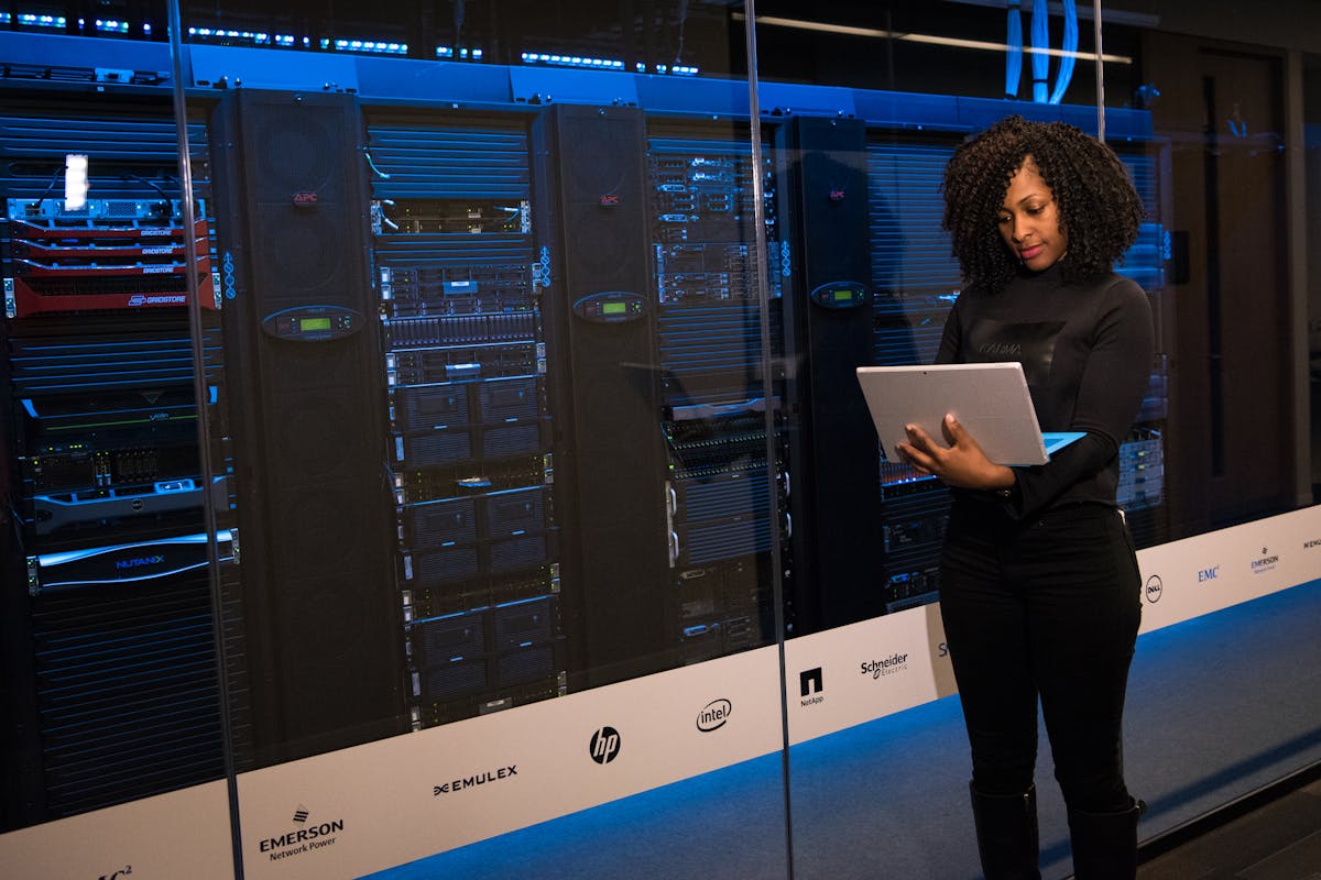 An image of a woman monitoring Layer 2 Networks by Christina Morillo