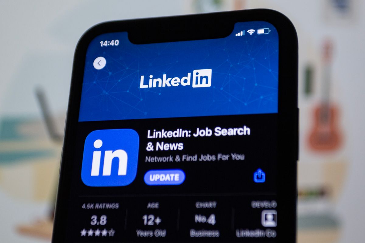 Close-up image of the LinkedIn app update screen on a smartphone display by Bastian Riccardi